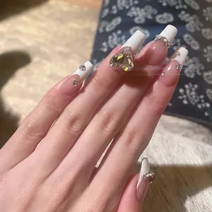 French white tip press-on nails with long trapezoid shape and sparkling heart rhinestone