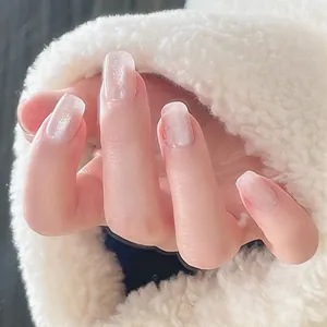 Short square-oval press-on nails in translucent pearl white with cat eye glitter effect