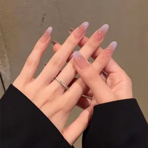 Macro detail of long oval press-on nails with purple gradient and glossy finish