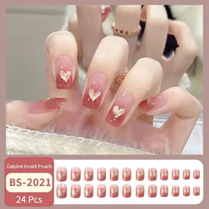 Faux ongles dégradé rose pêche avec décorations cœur pailleté doré, set de 24
