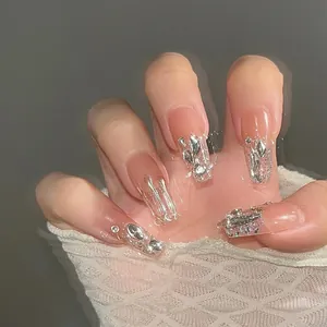 Chic nude press-on nails with 3D silver liquid metal accents and sparkling crystals