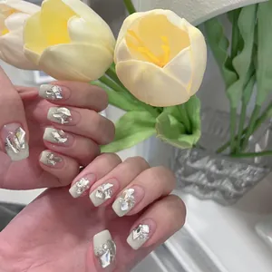 Handmade light green French press-on nails with sparkling rhinestones and pearls