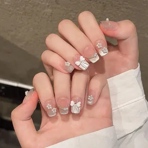 Handmade press-on nails with 3D bows, pearls, and cat-eye finish in French style