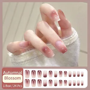 Brown ombre gradient press-on nails set in medium trapezoid shape with glossy finish