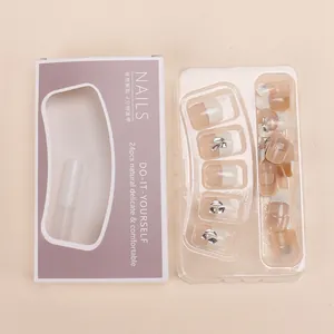 Handmade short French press-on nail kit with pink gradient and glitter in purple box