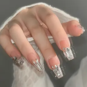 Nude pink coffin press-on nails with silver liquid metal lines and sparkling rhinestones
