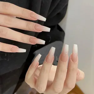 Detailed view of long coffin-shaped nails featuring a classic French ombre gradient look