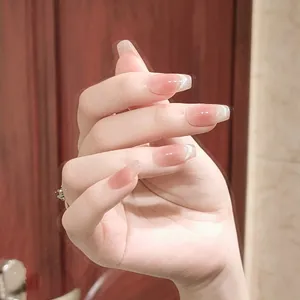 Pink gradient square press-on nails with silver glitter tips and a glossy jelly finish