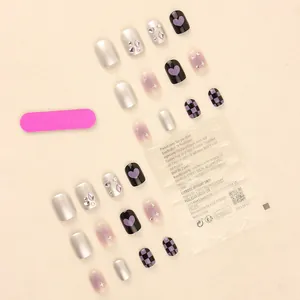 Handmade aurora heart press-on nails with purple checkerboard and glitter star designs