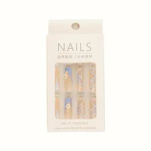 Faux ongles longs bleus papillon et fleurs avec 24 pièces dans une boîte à fenêtre