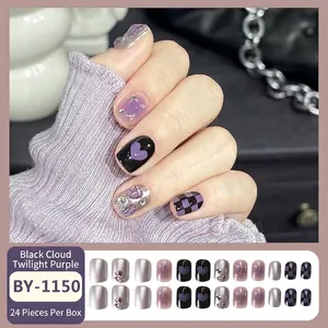 Purple gradient press-on nails with black heart patterns and checkerboard design