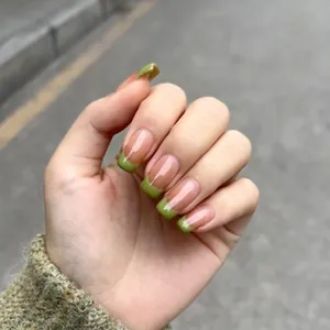 Spring green French tip press-on nails in long square shape with nude base