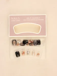 Detailed set of 24 pieces of brown matte and glitter press-on nails in a display box