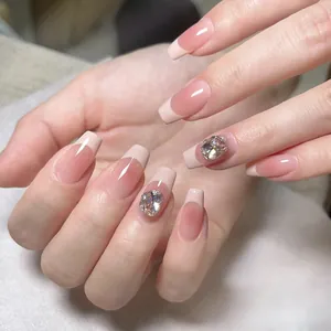 Handmade milky white French ombre press-on nails with luxury rhinestone accents