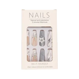 Long white press-on nails with star rhinestones and flame patterns in 24pcs packaging