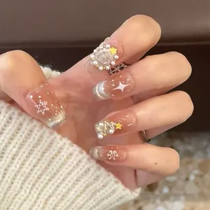 Detail of coffin nails with gradient pink base, 3D pearl Christmas tree and snowflakes