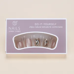 Detail of 24pcs champagne cat eye press-on nails set with 3D rhinestones in purple box