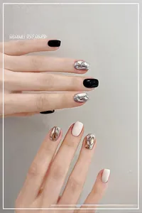 Detailed view of handmade dark black press-on nails with rhinestones and glitter finish