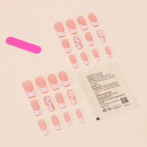 Medium length white flower press-on nails with rhinestones and full application kit