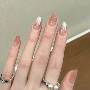 Pink gradient cat-eye press-on nails with 3D bow and red dot accent designs