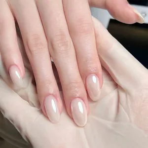 Minimalist glossy almond shape press-on nails in sheer jelly pink for women