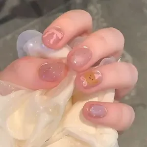 Handmade press-on nails with cute hand-painted bear, bow, and glitter in jelly pink-purple