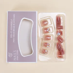 French style short press-on nails in dusty rose with glitter and rhinestone accents