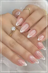 Detailed view of long almond French manicure with silver glitter outlines and lace background