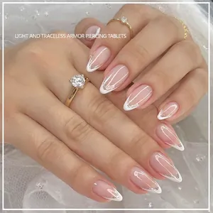 French tip press-on nails in nude pink with silver glitter accents, 24-piece set