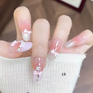 Pink gradient handmade press-on nails with 3D bows and sparkling silver glitter