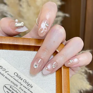 Handgefertigt Schleife Künstliche Nägel Mit Künstliche Perle Strass Nude Rosa Kurz Oval Falsche Nägel Für Damen Täglich Party Nagelkunst