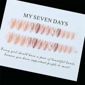 Nude pink press-on nail kit with glitter accents and wave designs in 24 piece set