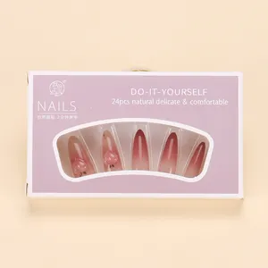 Close-up of 24pcs purple gradient press-on nails with 3D peach charms in box