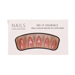 Pink gradient press-on nails with white hearts, stars, and rhinestones set of 24 pieces