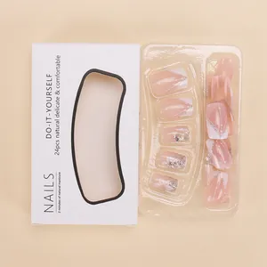 French style nude pink false nails with silver glitter lines and rhinestones in box