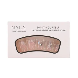 Pink French press-on nails with glitter star and rhinestone decor in a 24-piece set