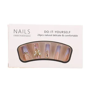 Faux ongles carrés extra longs style French rouge avec papillon 3D doré et strass