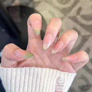 Pink and green gradient almond press-on nails with cat-eye magnet effect and high gloss