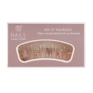 Short pink press-on nails with 30 pieces featuring 3D pearls, gold drops, and rabbit art