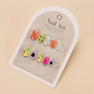 Detail showing 10 pieces of colorful cartoon hand-painted press-on nails for girls