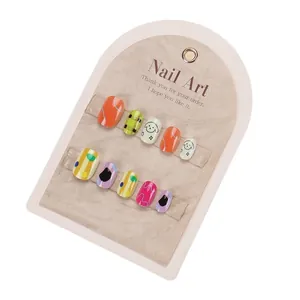 Set of 10 cartoon dog nail art press-on nails for girls with orange and green designs