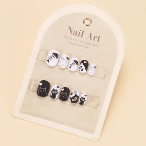 Cute black and white cartoon cat press-on nails set with matte finish for girls