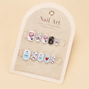Kids cute cartoon press-on nail kit with bear and floral designs on display card