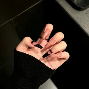 Glossy long coffin press-on nails with black French tips and nude pink base for women