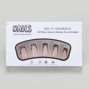 Detail view of French leopard print press-on nails in white window display packaging