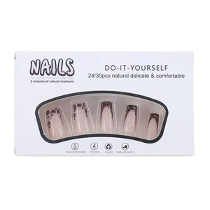 French leopard print press-on nails set with almond nude base in window display box