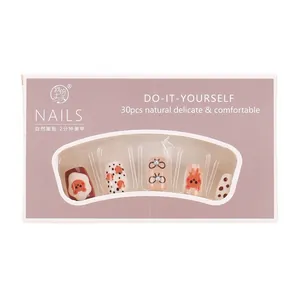 Cute cartoon bear press-on nail kit with 30 short pieces in elegant pink packaging
