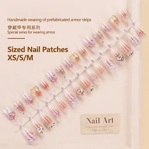 Handmade cat eye press-on nails with pink gradient, 3D flowers, and luxury crystal diamonds