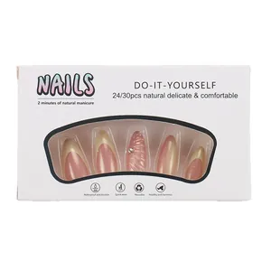 French tip press-on nails with yellow shell texture and rhinestone accents in mid-length