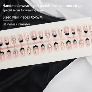 Cat eye cat-eye false nails in nude pink and black French tip with heart crystal
